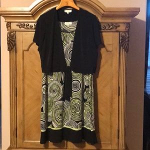 Woman’s Plus size dress with black crop jacket.